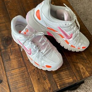Nike women’s Size 8 pink, white and orange sneaker. Like new with box.